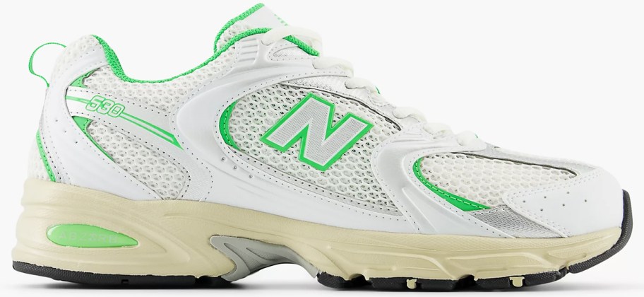 white and green running shoe