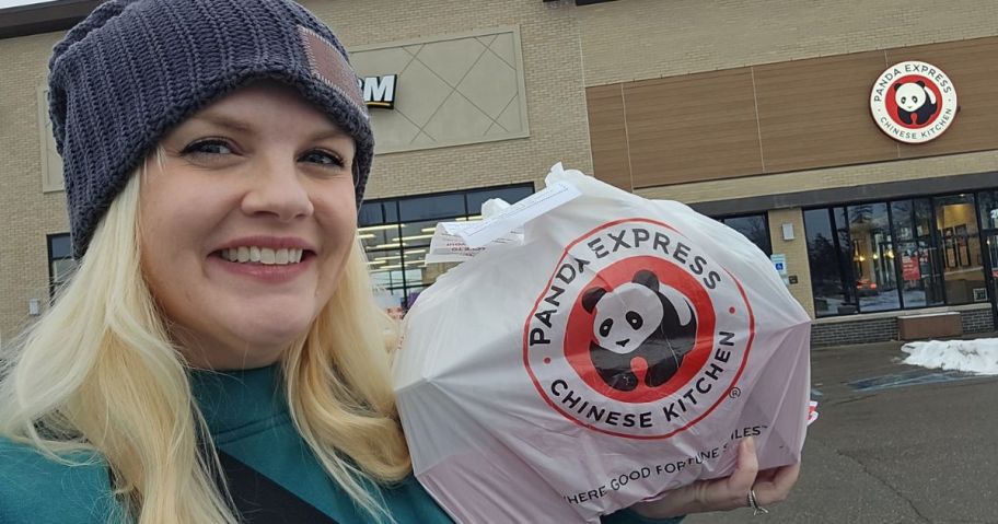 woman holding a Panda Express takeout Bag