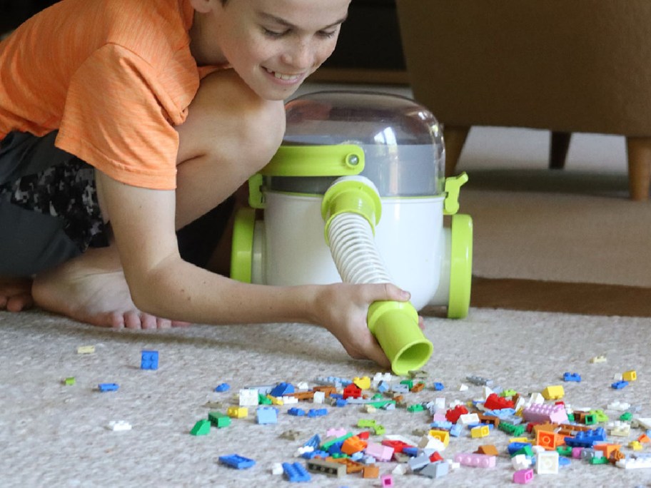 boy playing with a Pick-Up Bricks Vacuum