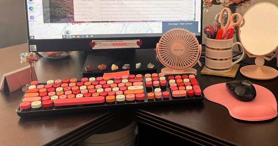 red and black keyboard and mouse on onlineputer desk 