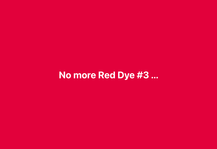 white letters reading "no more red dye #3" on a red background 