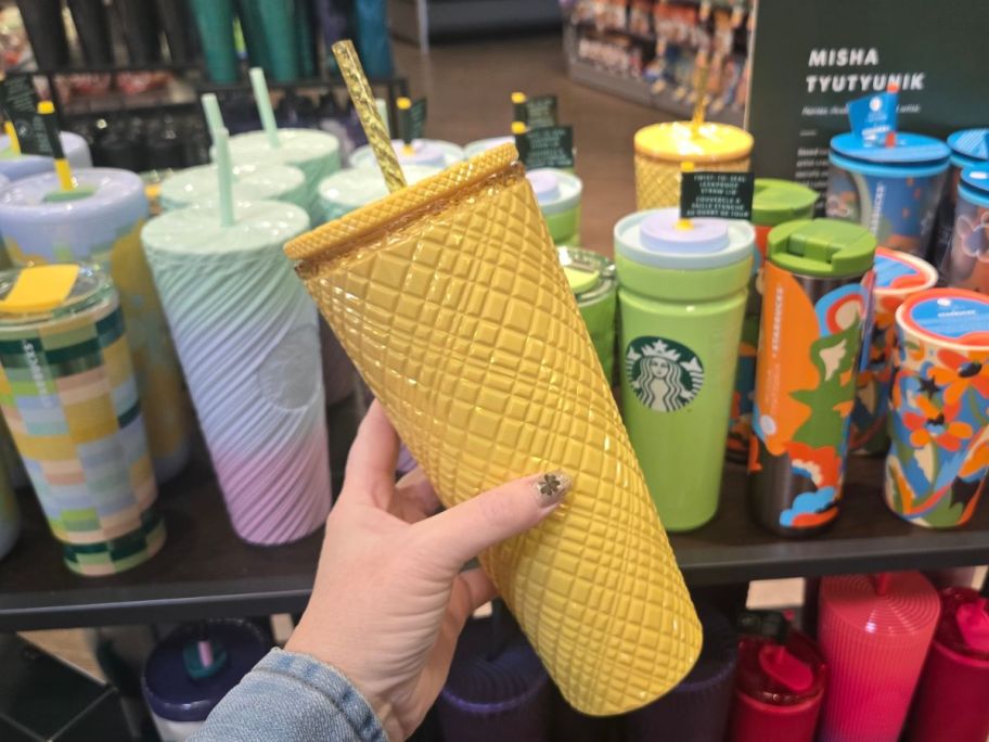 Starbucks Tumbler w/ Straw in hand in store