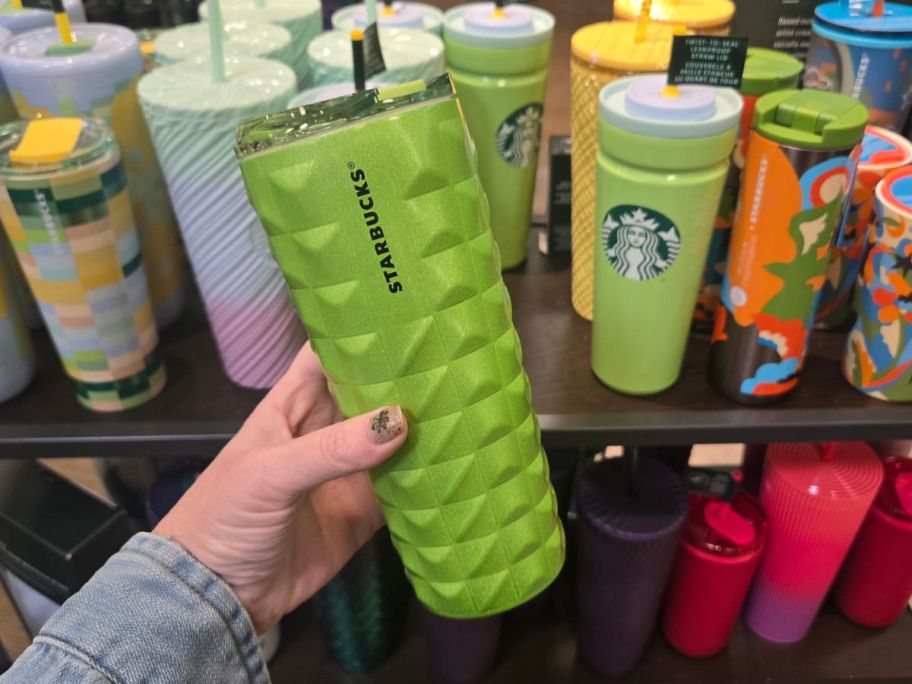 Starbucks Green Tumbler in hand in store