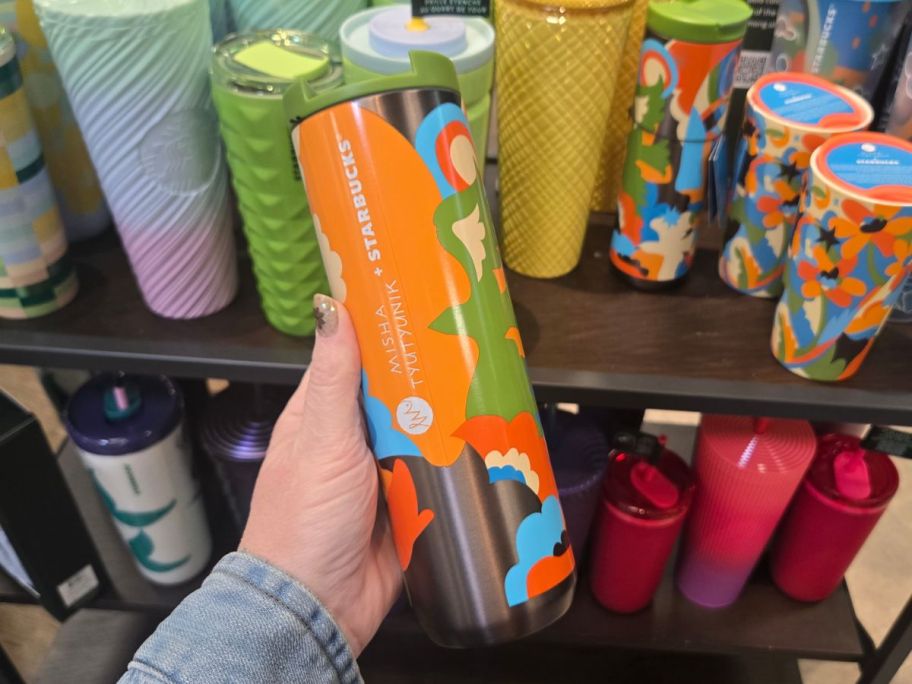 Starbucks Multi-Color Tumbler in hand in store