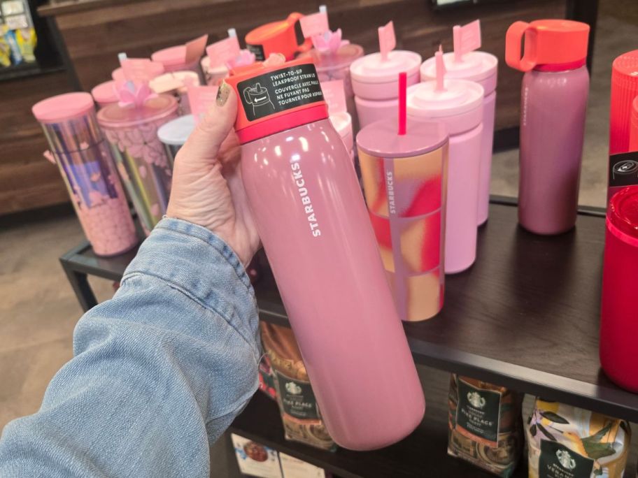 Starbucks Plum 20oz Water Bottle in hand in store