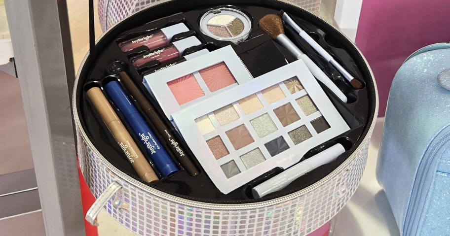 opened round beauty box with makeup products inside