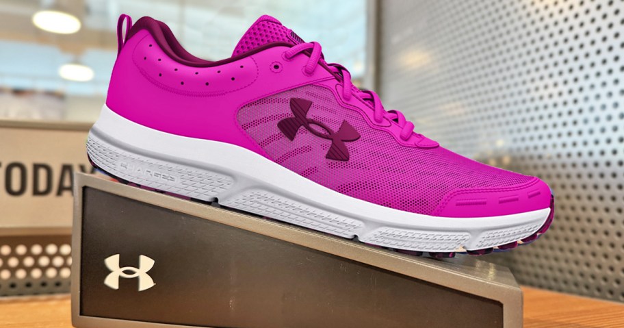 pink under armour running shoe on display in store