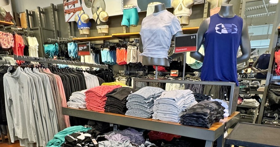 display of under armour shirts in store