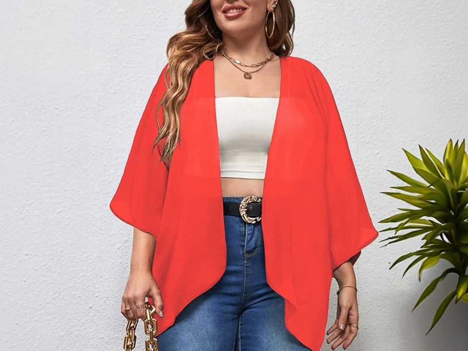 woman wearing red kimono with jeans