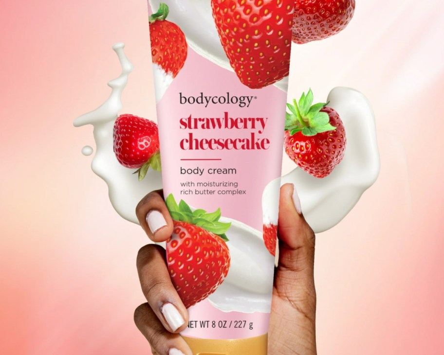 hand holding strawberry lotion