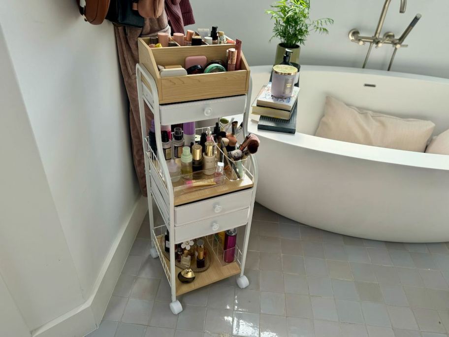 makeup stand in bathroom with tons of cosmetics products