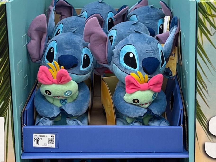 plush Disney Stitch holding Scrump on display in Walmart
