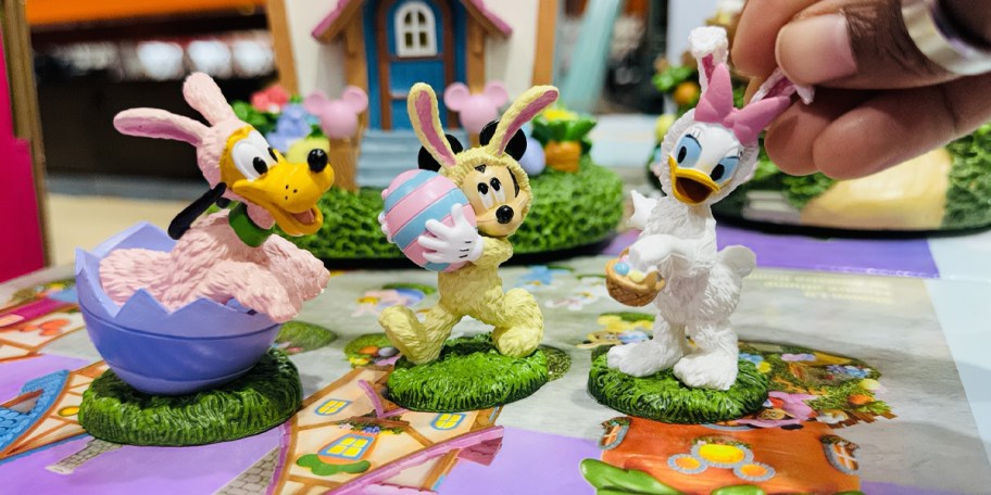 goofy, mickey, and daisy village pieces 