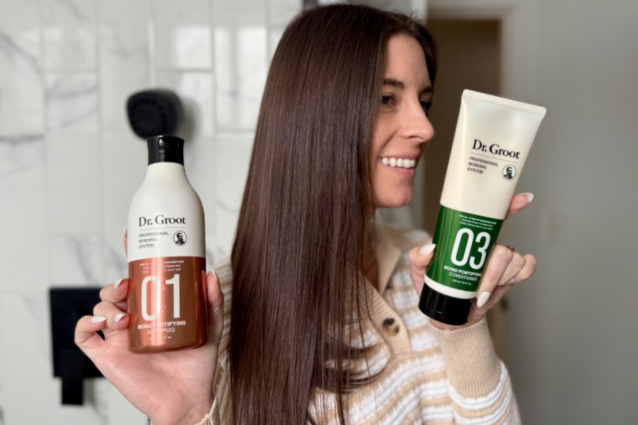 woman showing side of head holding two haircrare products