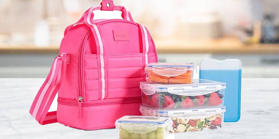 hot pink lunchbag with accessories on counter