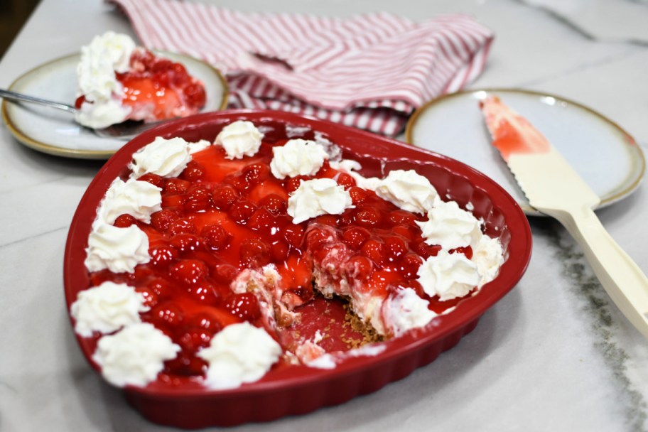 heart cherry delight dessert with piece cut out 