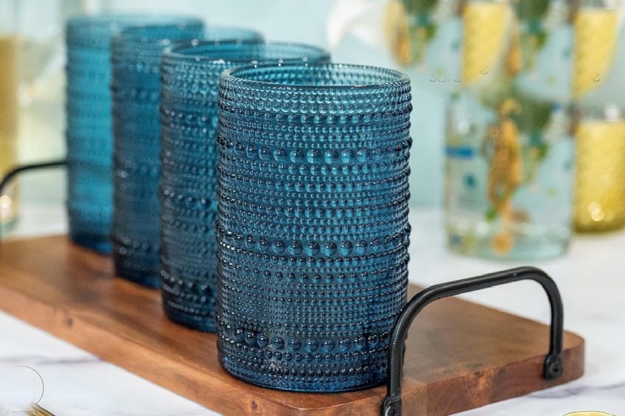 tall blue beaded glasses on tray