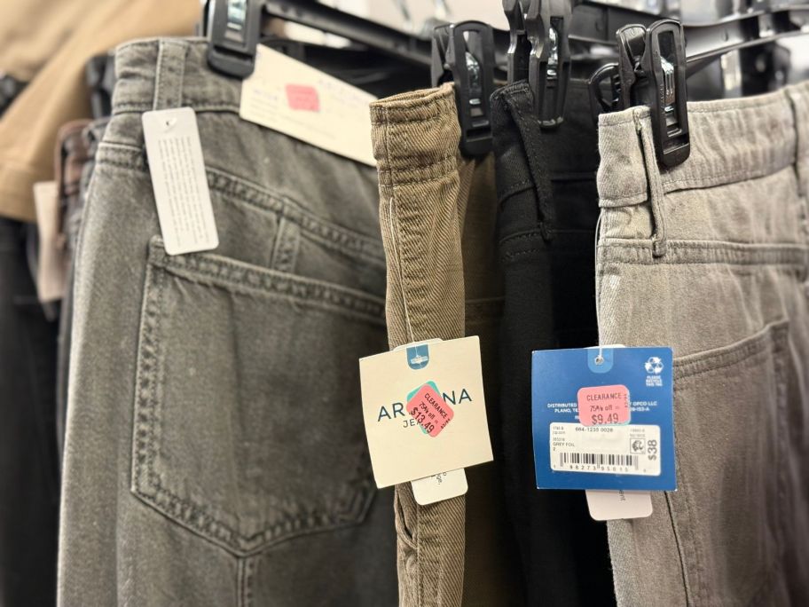 women's jeans hanging in store