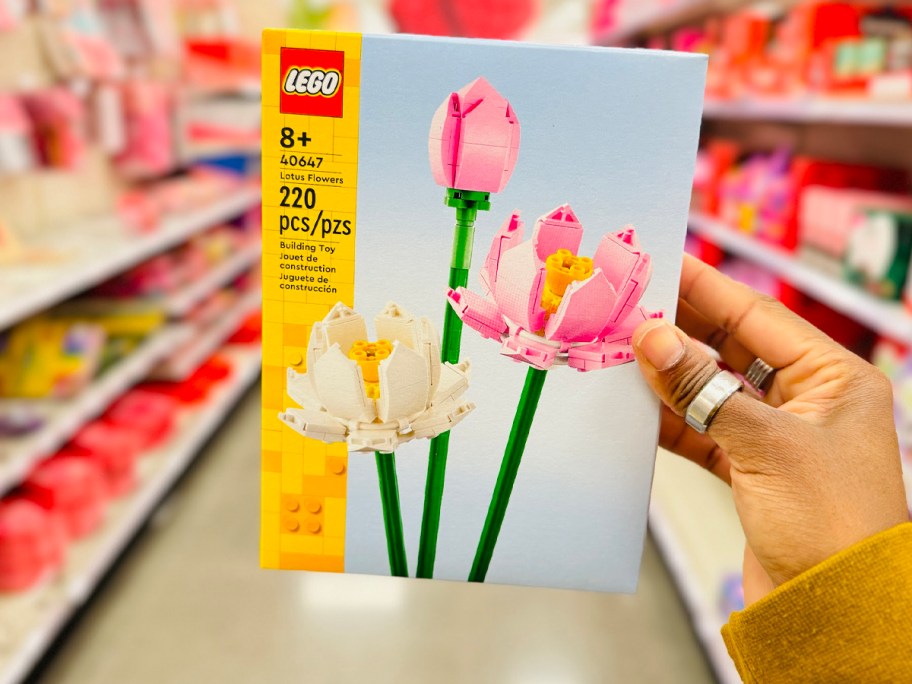 hand holding lego lotus flowers set 