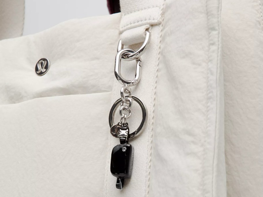 mini belt bag charm on white bag