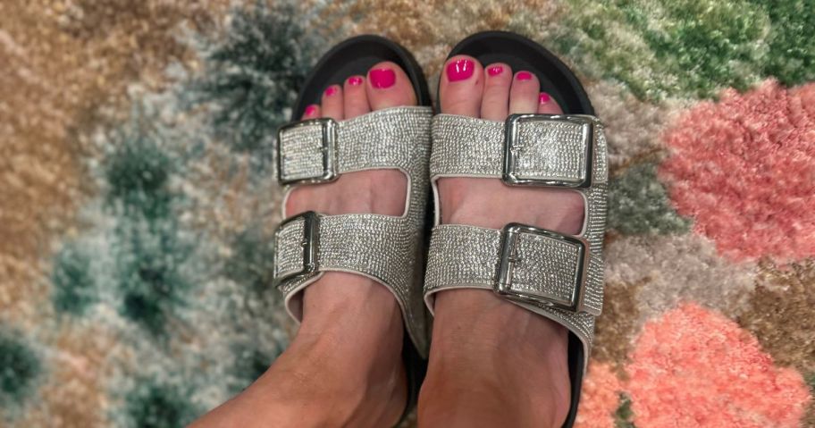 woman wearing Madden NYC Women's Embellished Footbed Sandals in black and silver