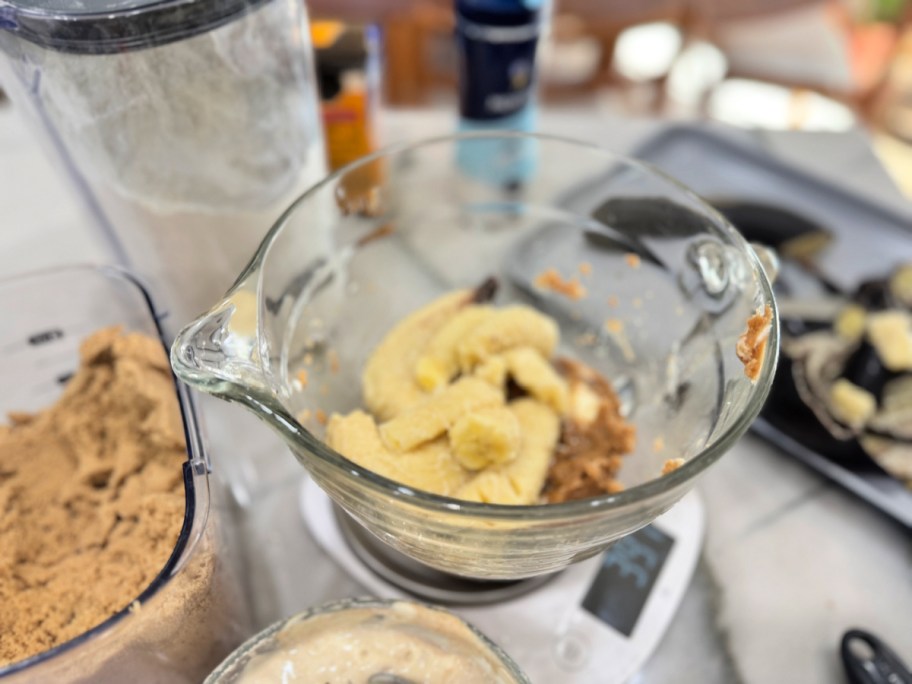 mashed banana in mixing bowl to make banana bread