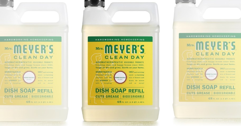 a large bottle of Mrs. Meyers Hand Soap Refill in Honeysuckle, with transparent bottles on each side