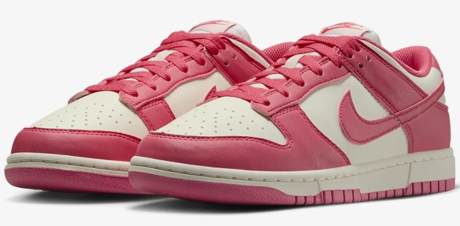 a pair of pink and off white women's Nike Dunk sneakers