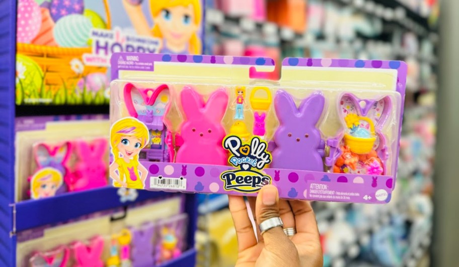 hand holding up a polly pocket peeps playset in a store aisle