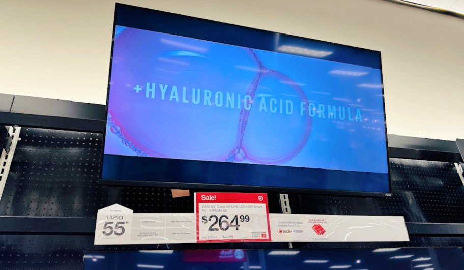 sale sign under a TV on display