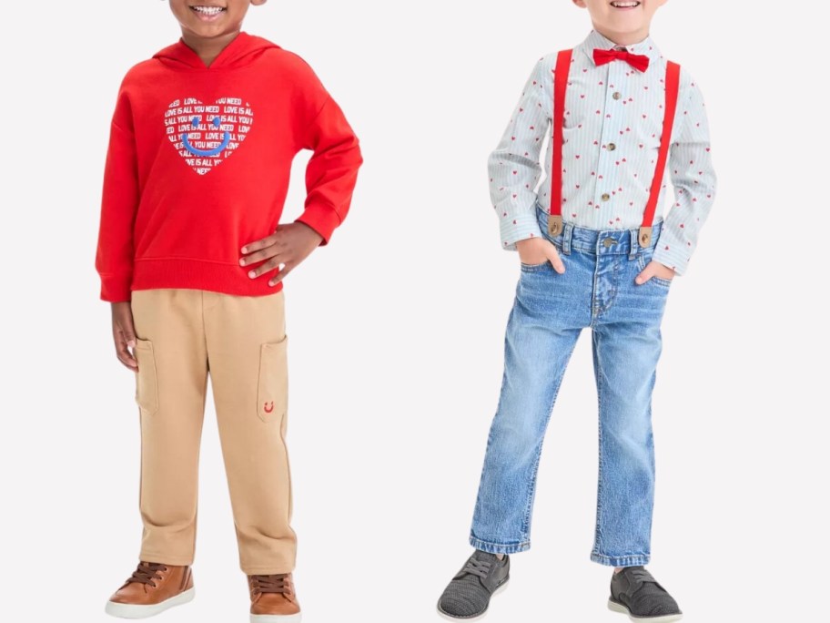 little boy wearing a red hoodie with a heart and smiley face on it and tan pants, and little boy wearing a button down shirt with red suspenders and jeans