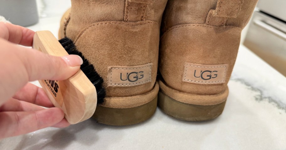 using a shoe brush to clean Uggs 