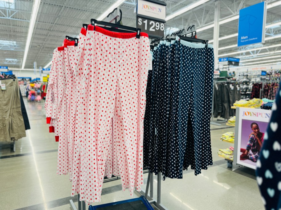 two sleep pants hanging on rack in walmart