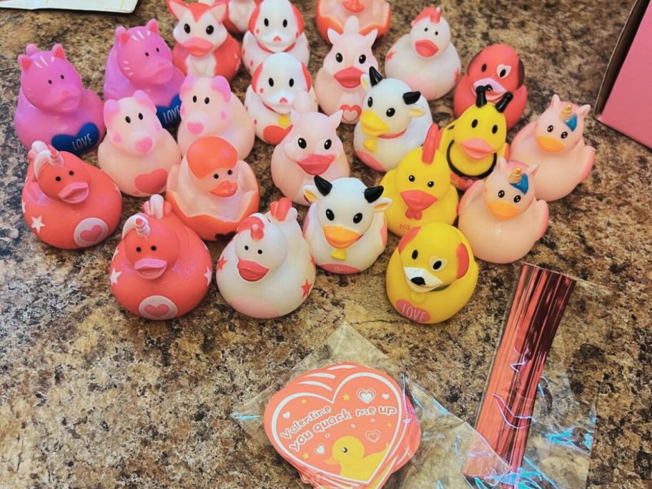 various Valentines rubber ducks with gift tags on counter