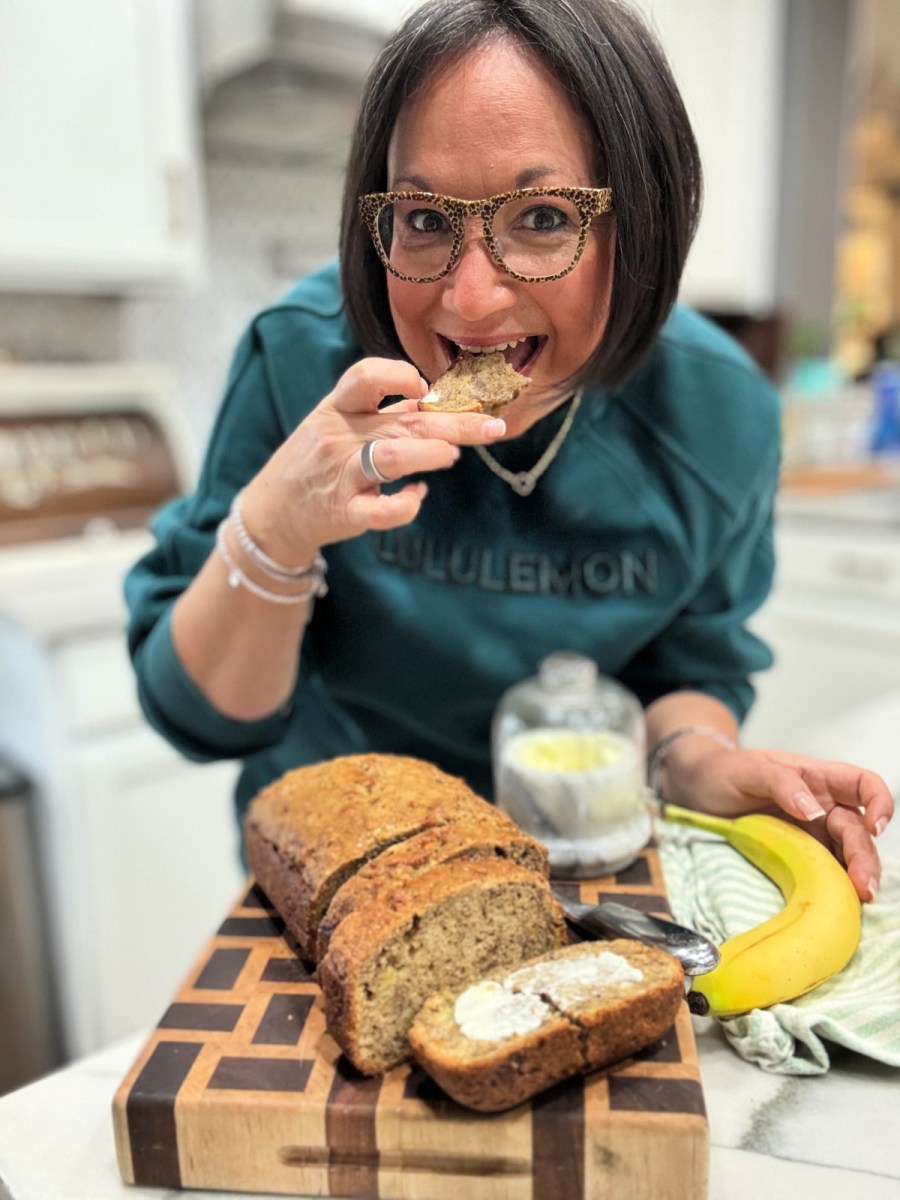 woman eating homemade sourdough banana bread