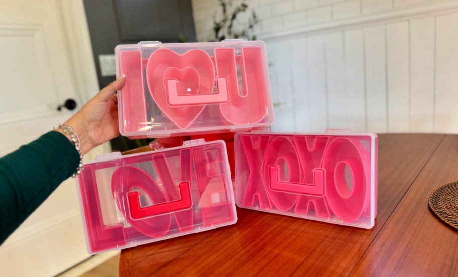 i heart u, love, and xoxo valentines day snack boxes from cook with color displayed on a table