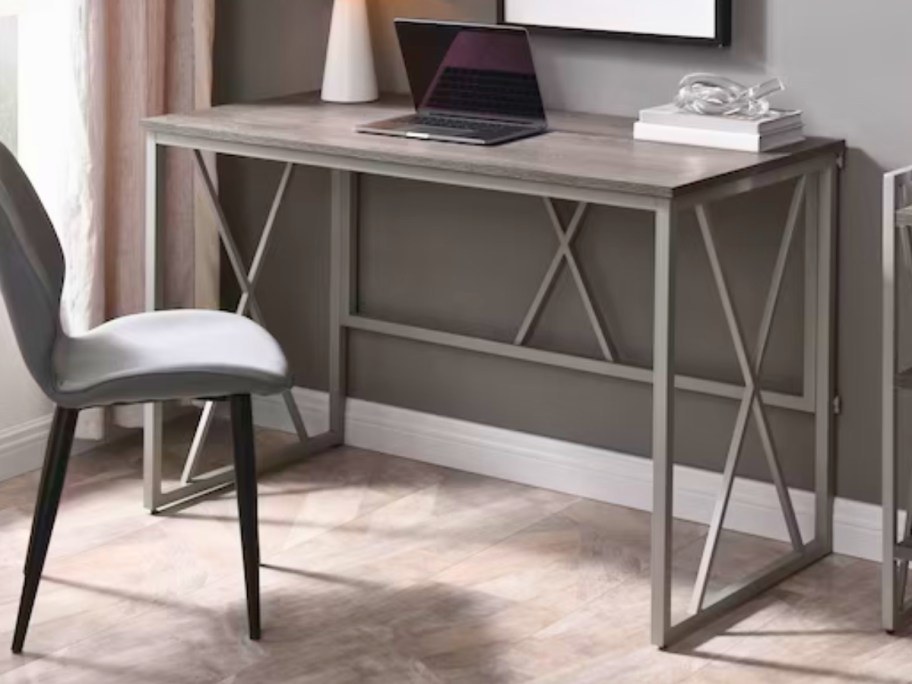 a grey modern style desk with a wood top in a home office