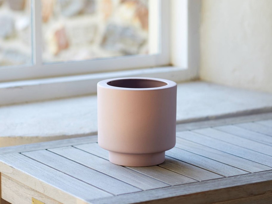 Anthropologie planter displayed on top of the table