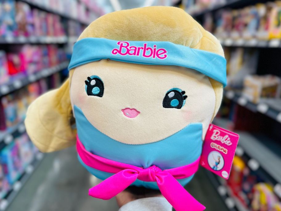 hand holding up a Barbie Cutopia 10 Plush 