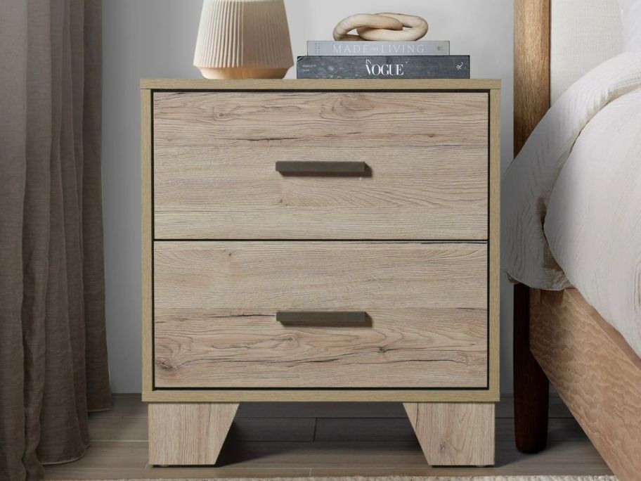 A wooden 2-drawer nightstand