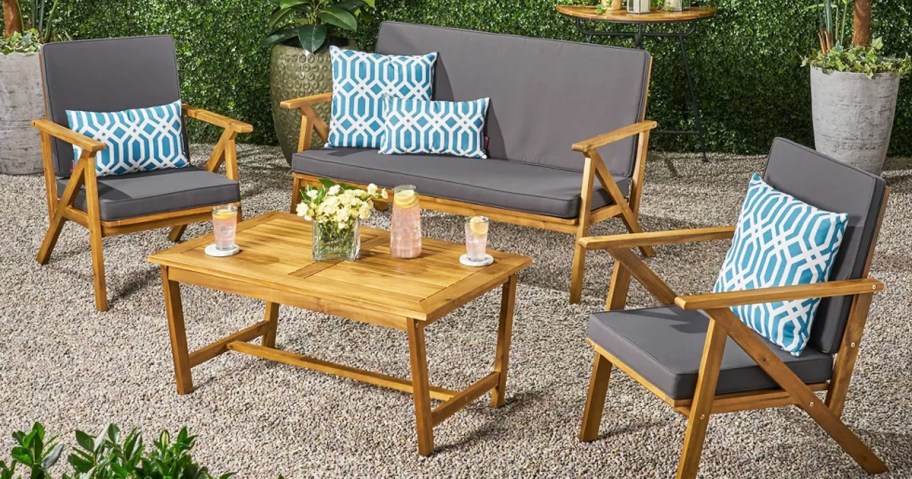 4 piece wood patio furniture set with grey cushions 