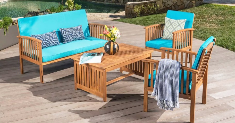 4 piece wood patio furniture set with blue cushions 