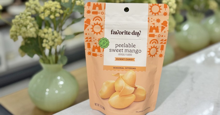 bag of Favorite Day Peelable Sweet Mango Gummy Candy on store display table near plant