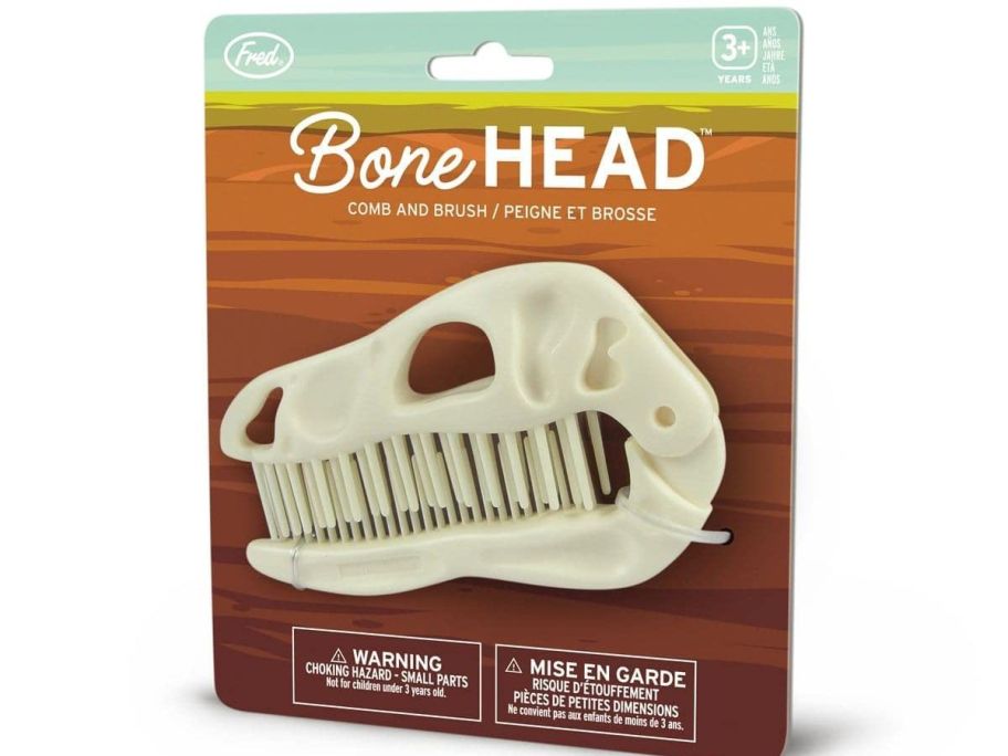 A brush shaped like a dinosaur skull