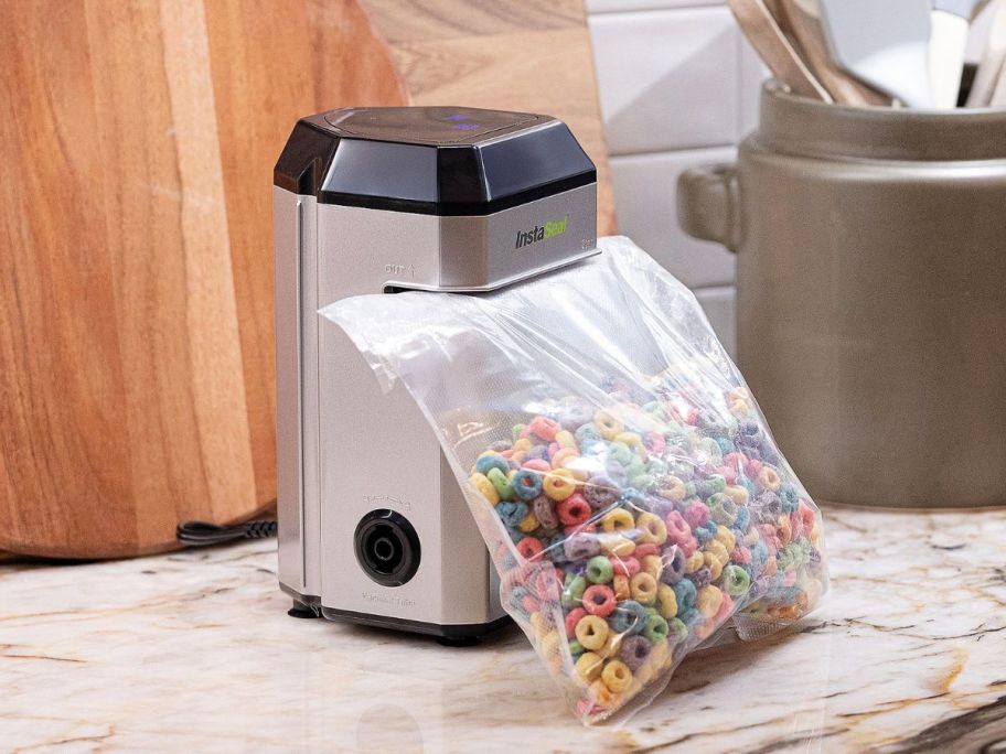 Bell & Howell InstaSeal Upright Bag Vacuum Sealer sealing a bag of cereal