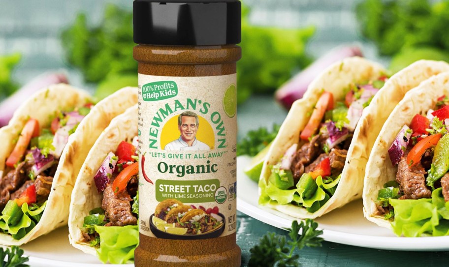 bottle of Newman's Own Organic Street Taco seasoning in front of plates of tacos