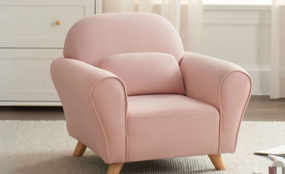 pink modern accent chair in a playroom