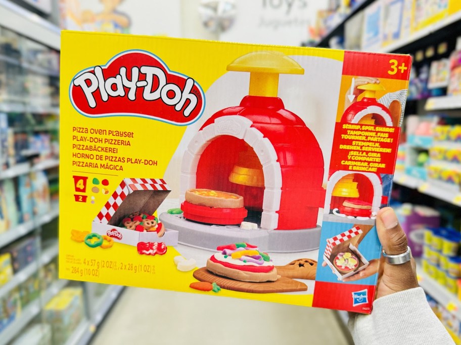 hand holding up Play-Doh Pizza Oven Playset box in store