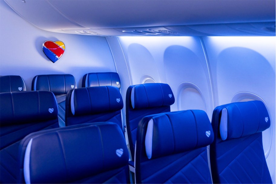 rows of blue seats inside a Southwest Airlines plane