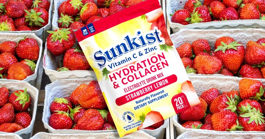 bag of Sunkist Collagen + Hydration drink mix sticks on top of strawberries 